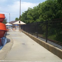large aluminum pool fence surrounding a community pool
