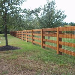 custom stained wooden post and board fence