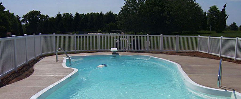 tan vinyl fence around backyard pool