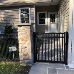 residential aluminum fence inspiration with stone column