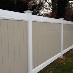tan and white vinyl backyard fence