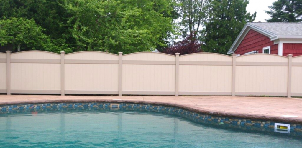 Tan pool fence made of vinyl