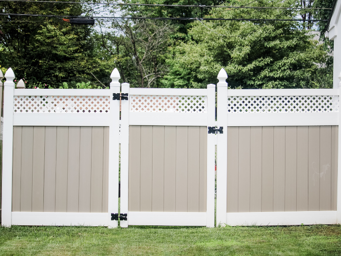 tan and white vinyl privacy fence panel