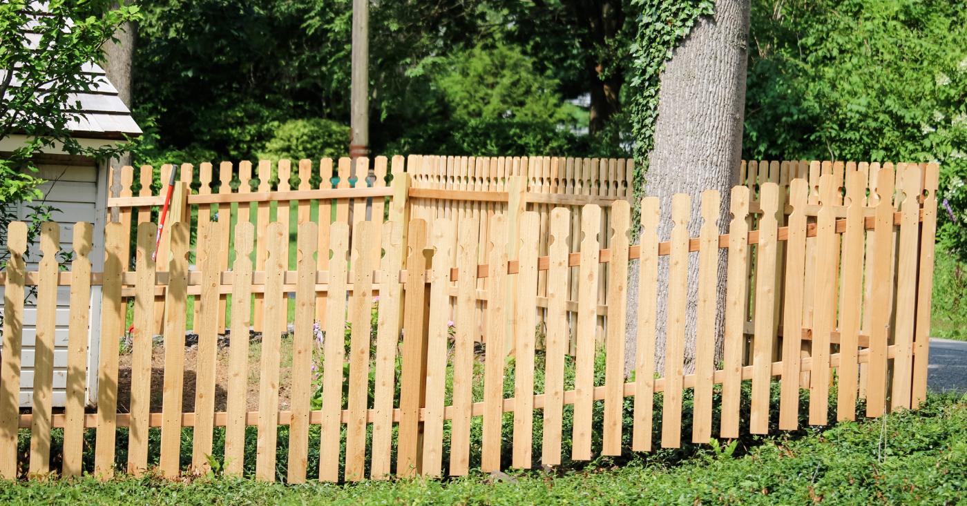 wood picket fenced in yard
