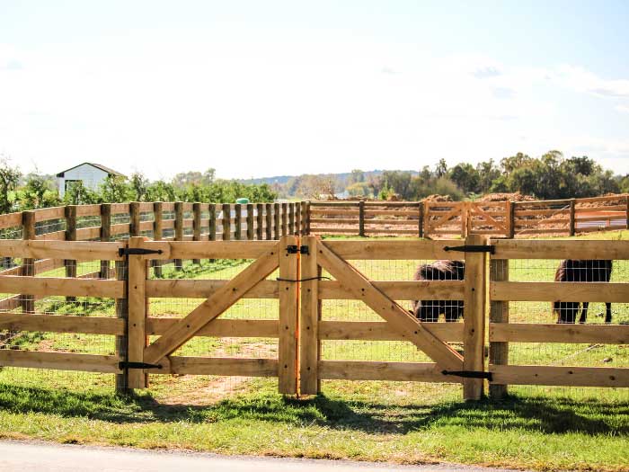 fence-company-installs-a-rustic-wooden-fence-around-a-piece-of-land-in-pa