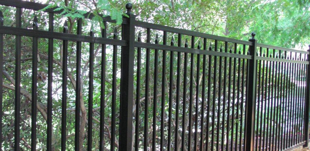 dark metal fence color with decorative elements 